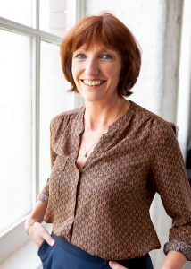 Businesswoman Helen Duncan photographed by a window