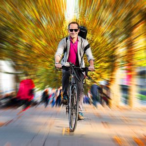 Violinist Richard Milone photographed on his bicycle for the fifty portraits exhibition